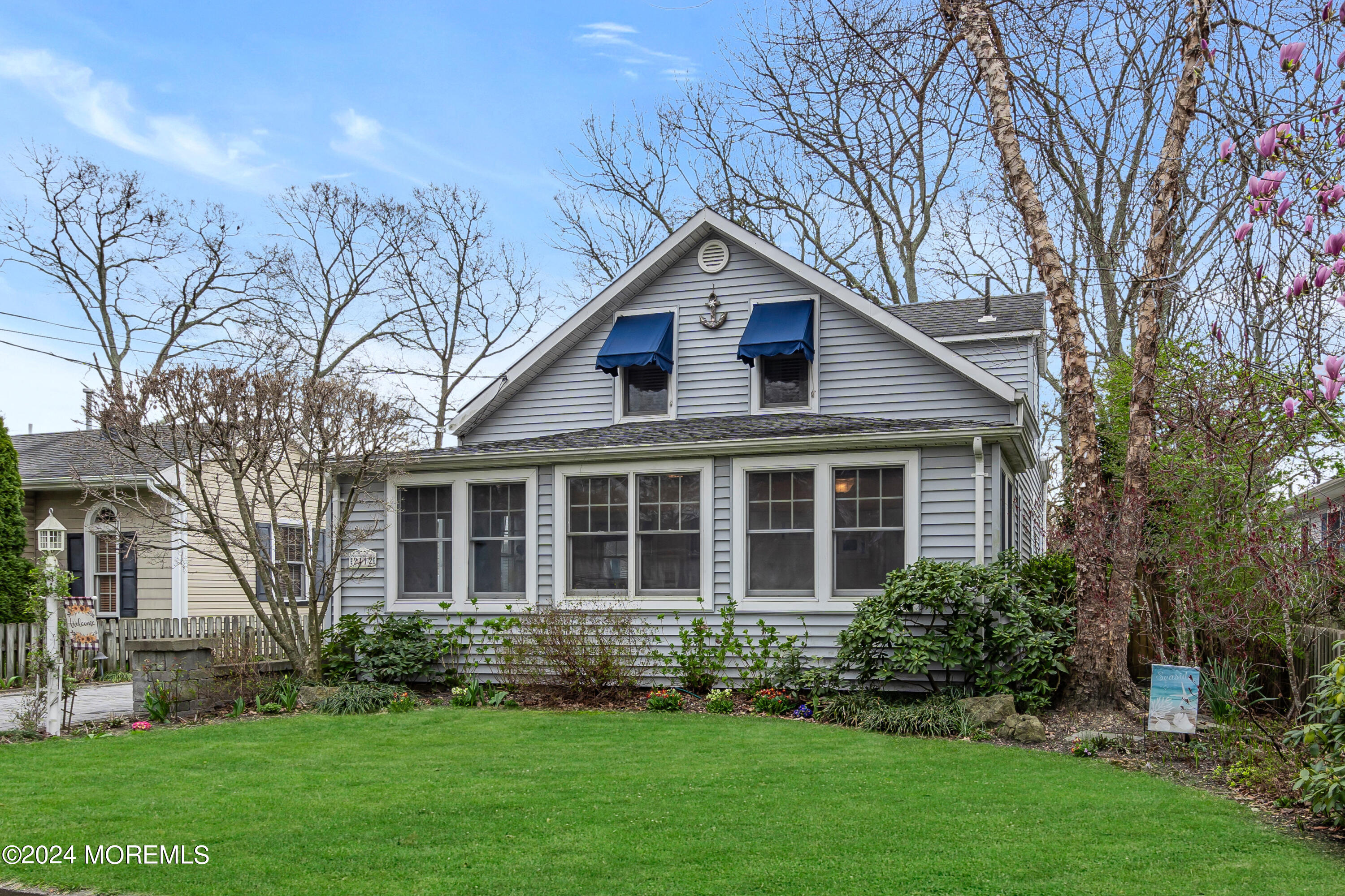 2412 Dunkle Road Point Pleasant, NJ 08742 - Photo 4 of 51 a front view of a house with a yard and trees