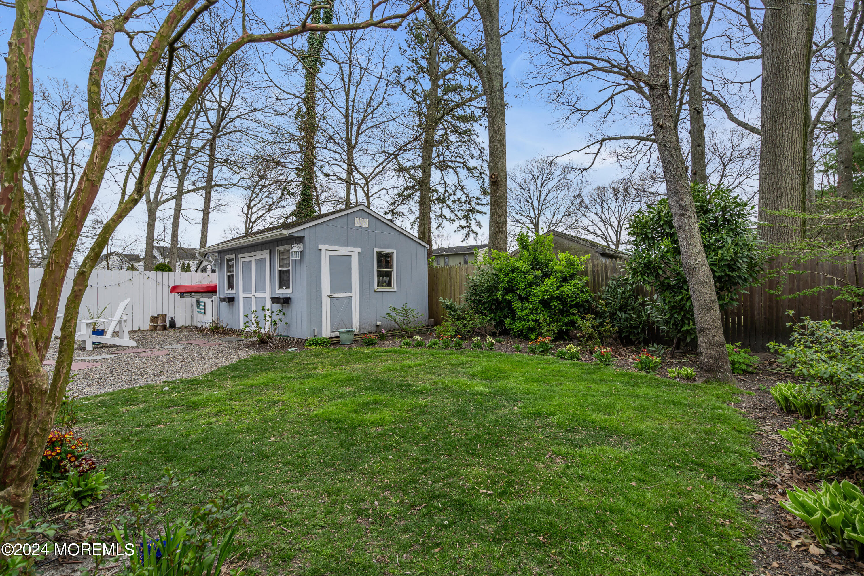 2412 Dunkle Road Point Pleasant, NJ 08742 - Photo 51 of 51 a white house that has a tree in front of it
