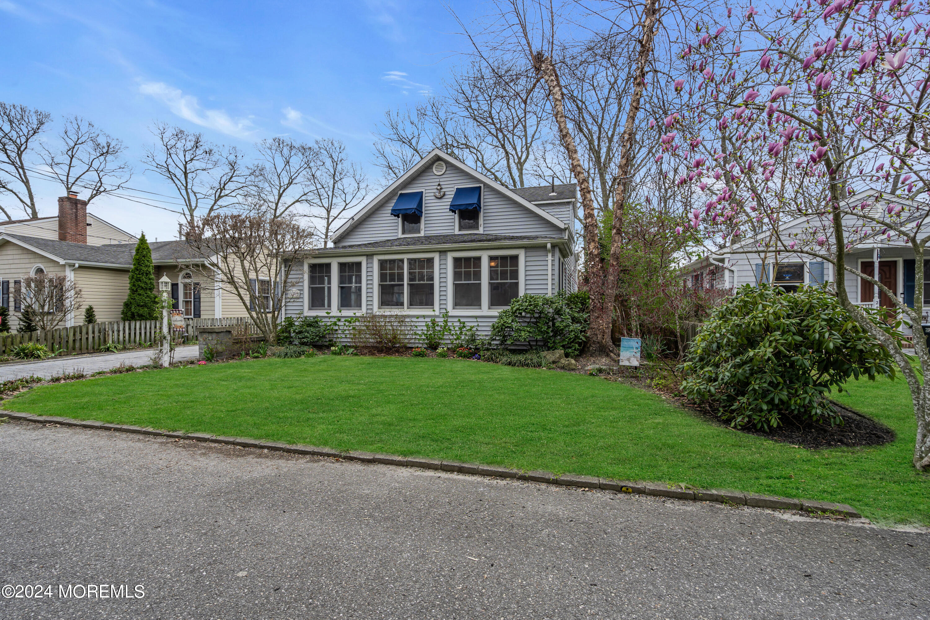 2412 Dunkle Road Point Pleasant, NJ 08742 - Photo 6 of 51 a front view of a house with a yard and trees