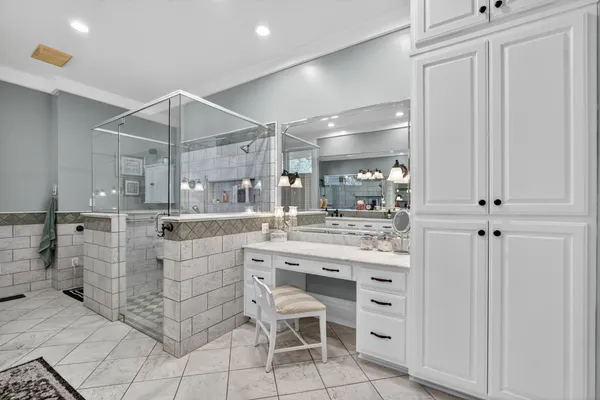 a bathroom with a sink double vanity and a mirror