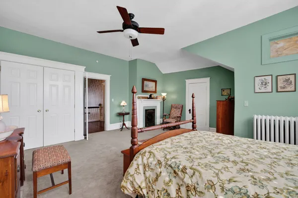 a bed room with furniture and a window