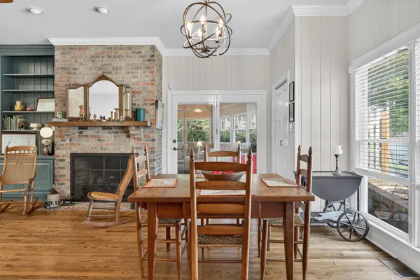 a living room with furniture a rug and a large window