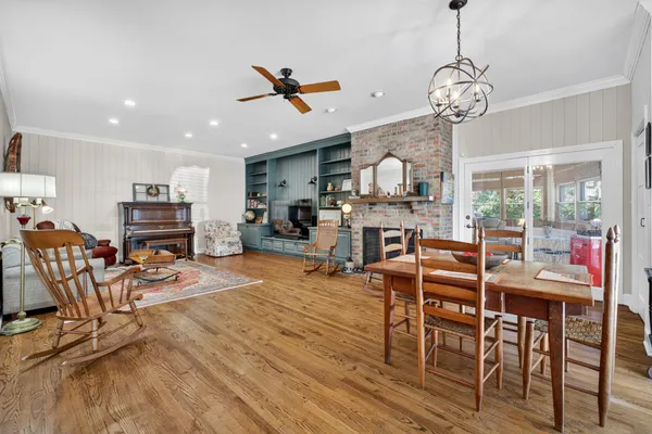 a utility room with stainless steel appliances granite countertop a refrigerator and a stove top oven