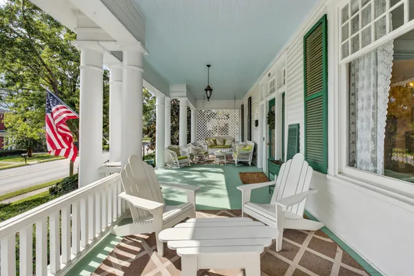 a view of an chairs and tables in the balcony