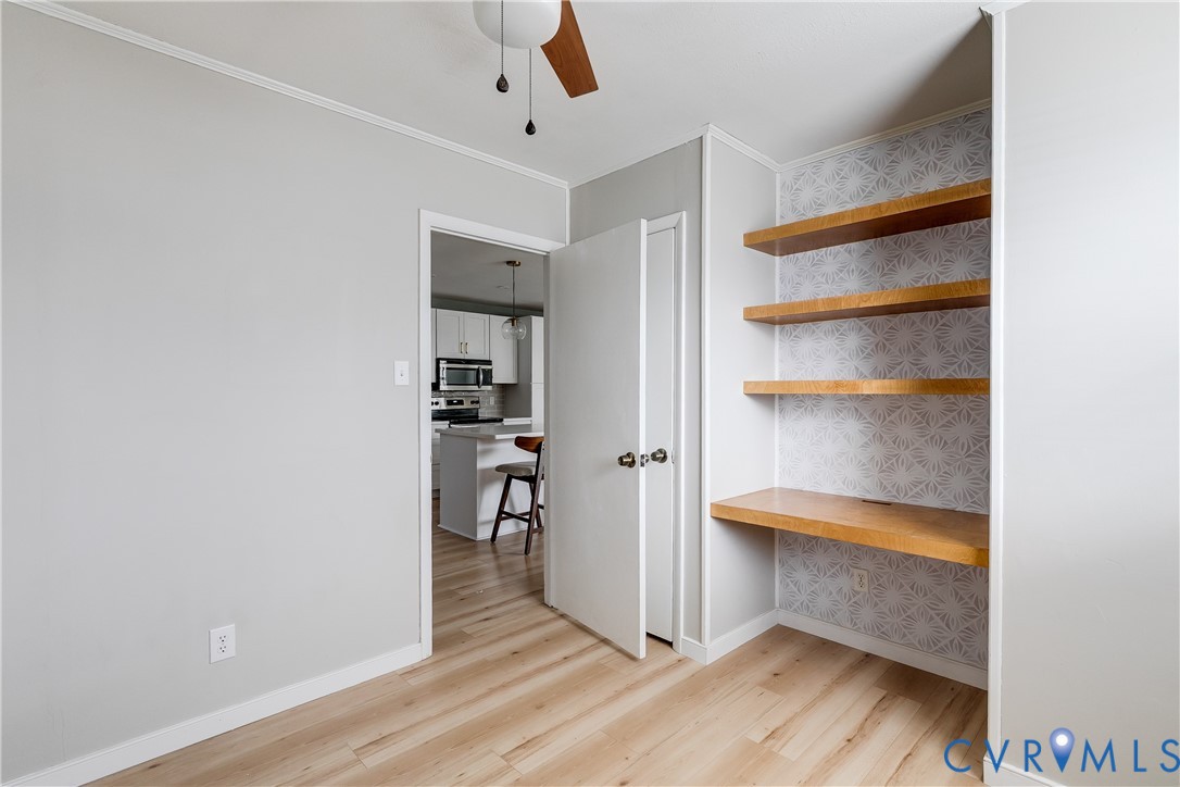 9814 Durango Road Henrico, VA 23228 - Photo 18 of 27 a view of walk in closet with empty racks