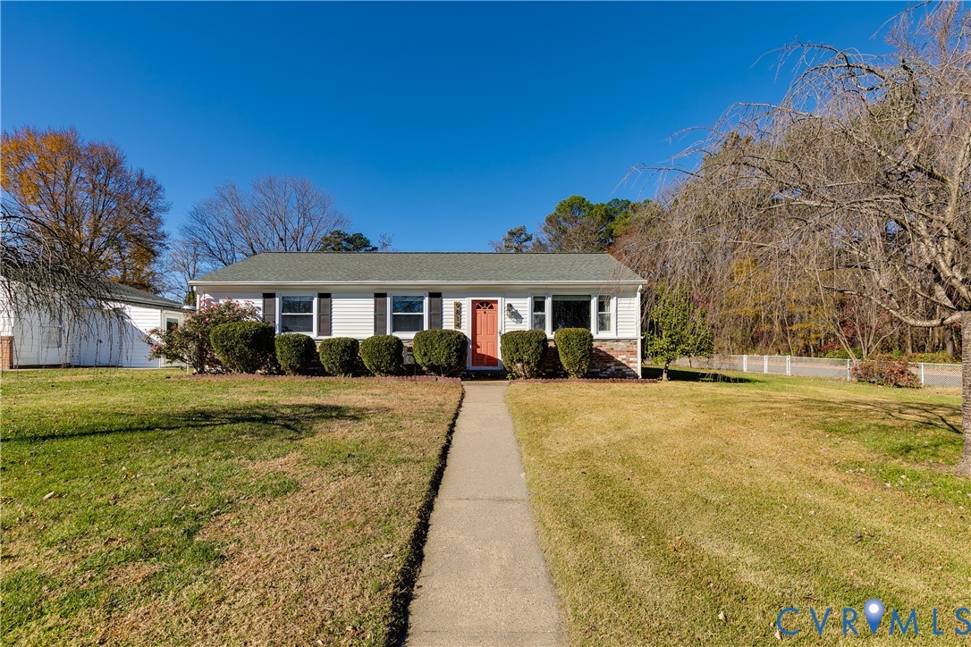 9814 Durango Road Henrico, VA 23228 - Photo 2 of 27 a front view of a house with a yard