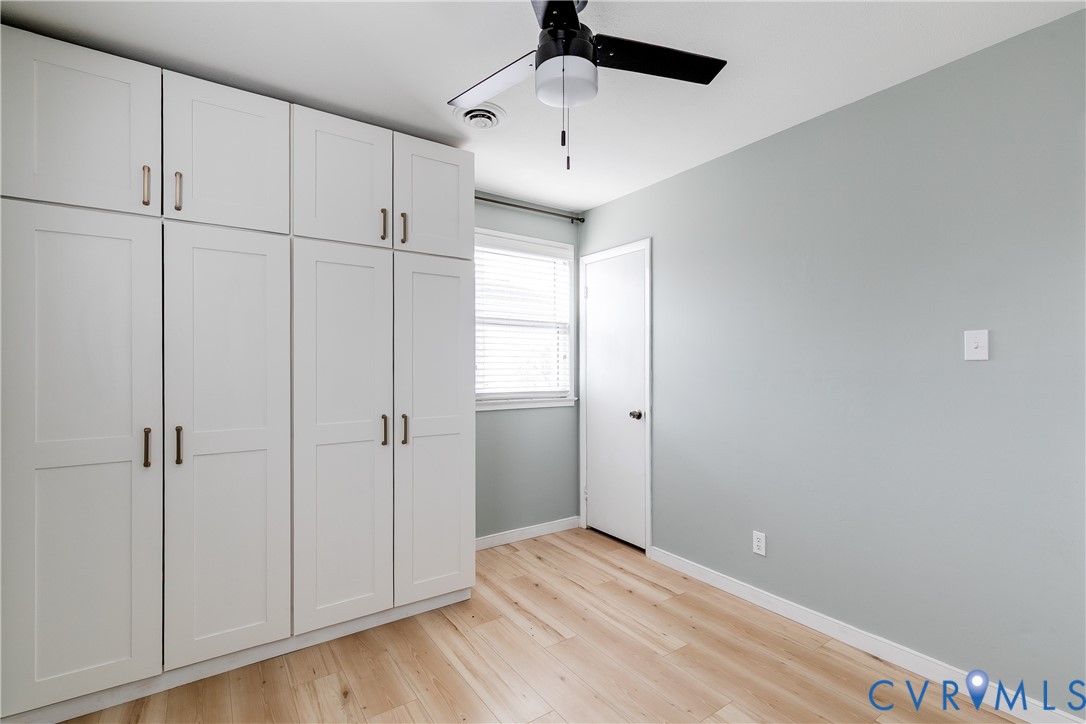 9814 Durango Road Henrico, VA 23228 - Photo 24 of 27 a view of empty room with wooden floor and fan