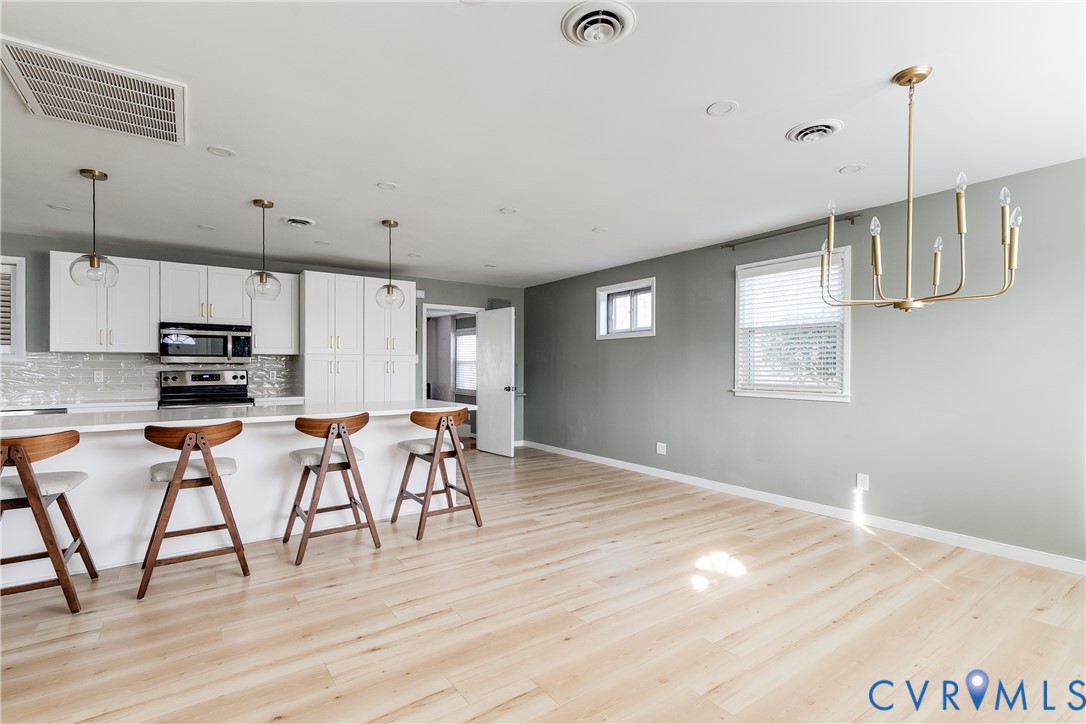 9814 Durango Road Henrico, VA 23228 - Photo 5 of 27 a view of kitchen with microwave and cabinets