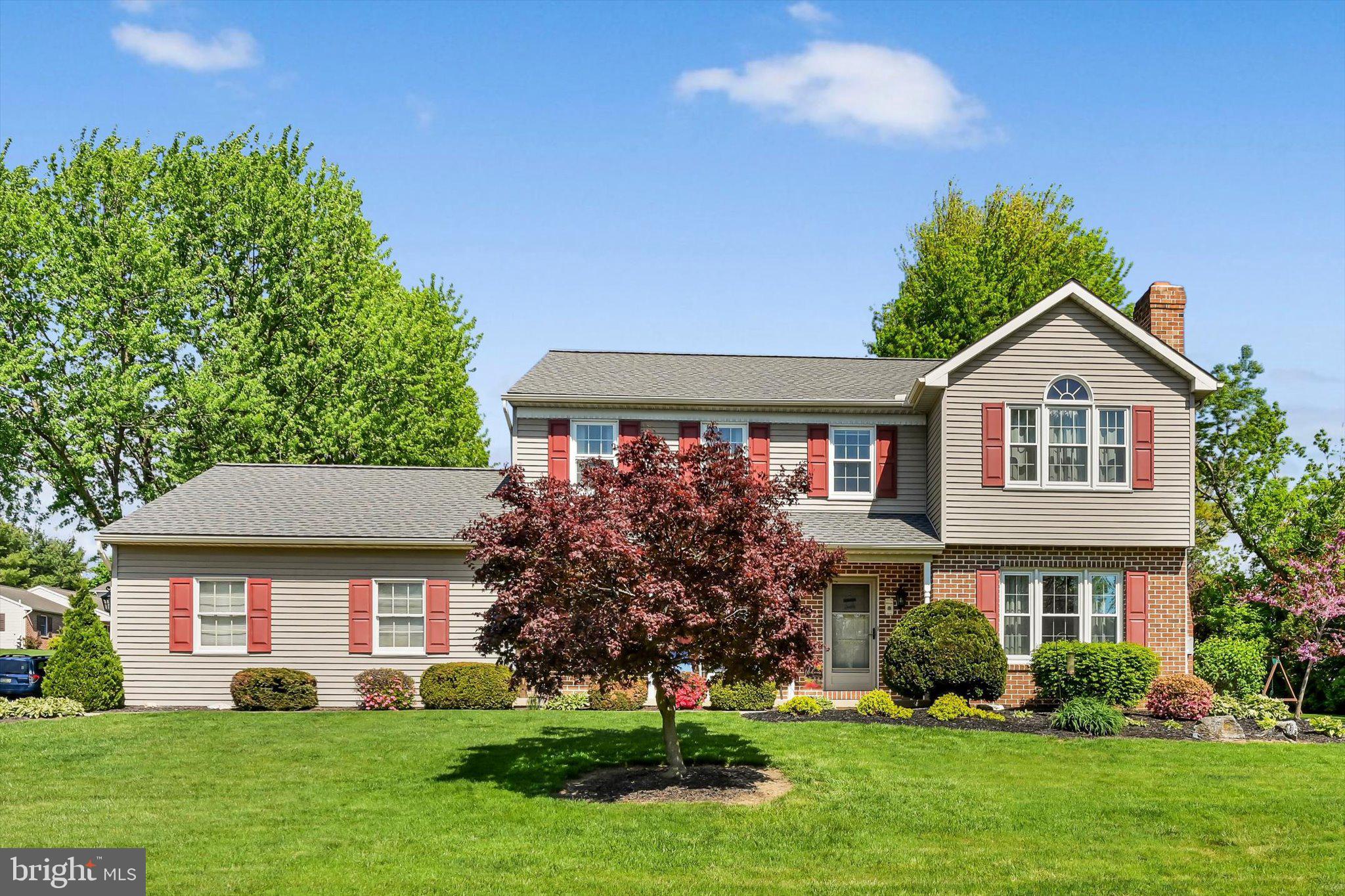 30 Edgewood Drive Lititz, PA 17543 - Photo 1 of 47 a front view of a house with a yard and trees