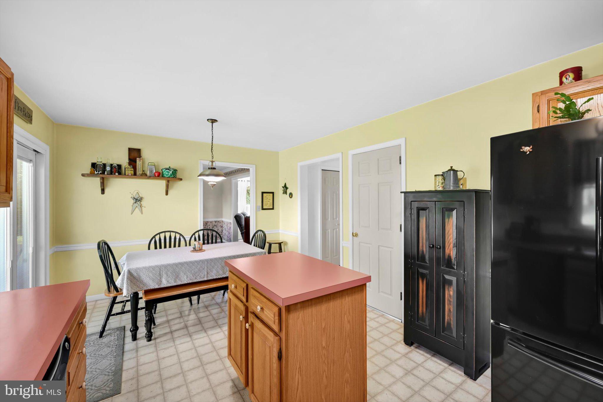 30 Edgewood Drive Lititz, PA 17543 - Photo 15 of 47 a kitchen that has a refrigerator and table in it