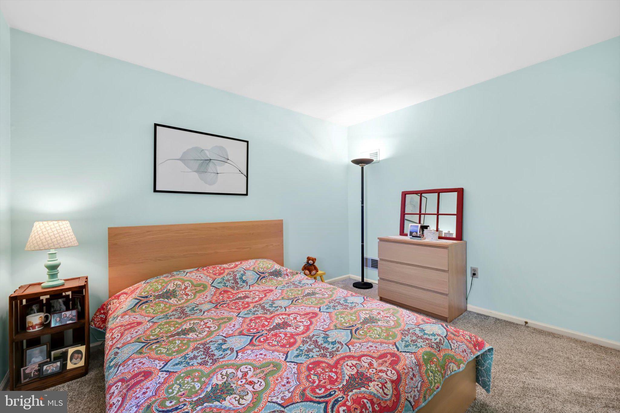 30 Edgewood Drive Lititz, PA 17543 - Photo 22 of 47 a bedroom with a bed and a lamp on dresser