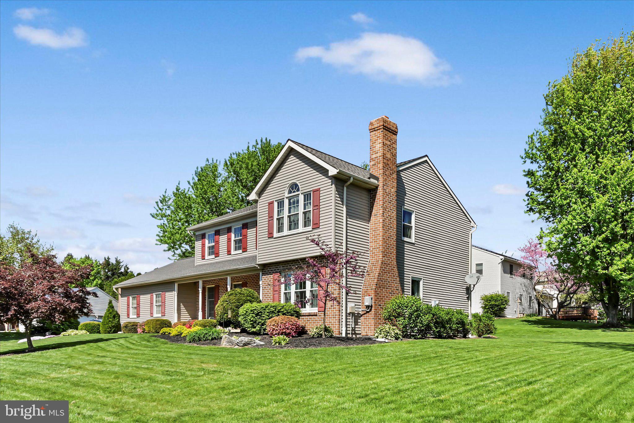 30 Edgewood Drive Lititz, PA 17543 - Photo 3 of 47 a front view of a house with a yard