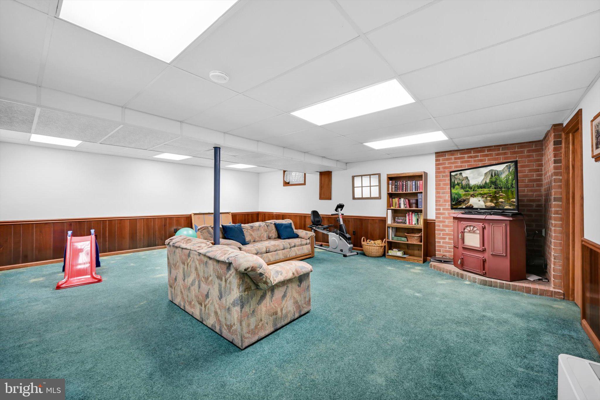 30 Edgewood Drive Lititz, PA 17543 - Photo 32 of 47 a living room with furniture a flat screen tv and a large window