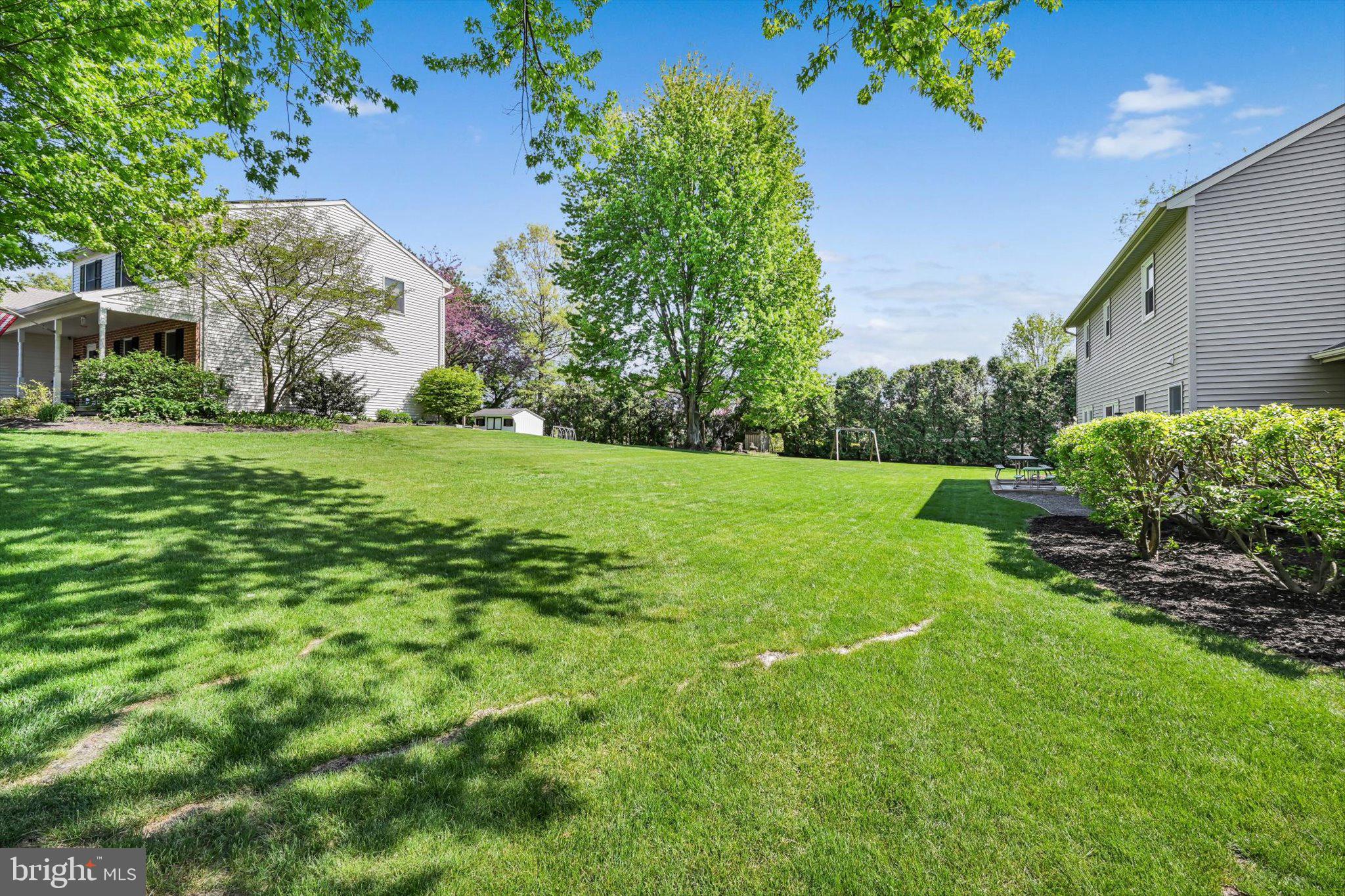 30 Edgewood Drive Lititz, PA 17543 - Photo 34 of 47 a view of a garden with a building in the background