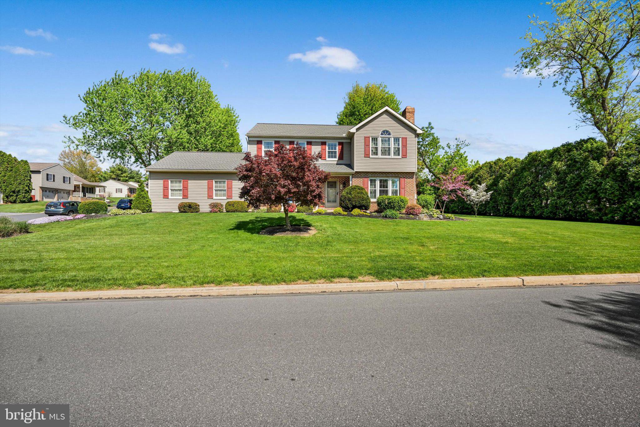 30 Edgewood Drive Lititz, PA 17543 - Photo 41 of 47 a front view of a house with a yard and garage