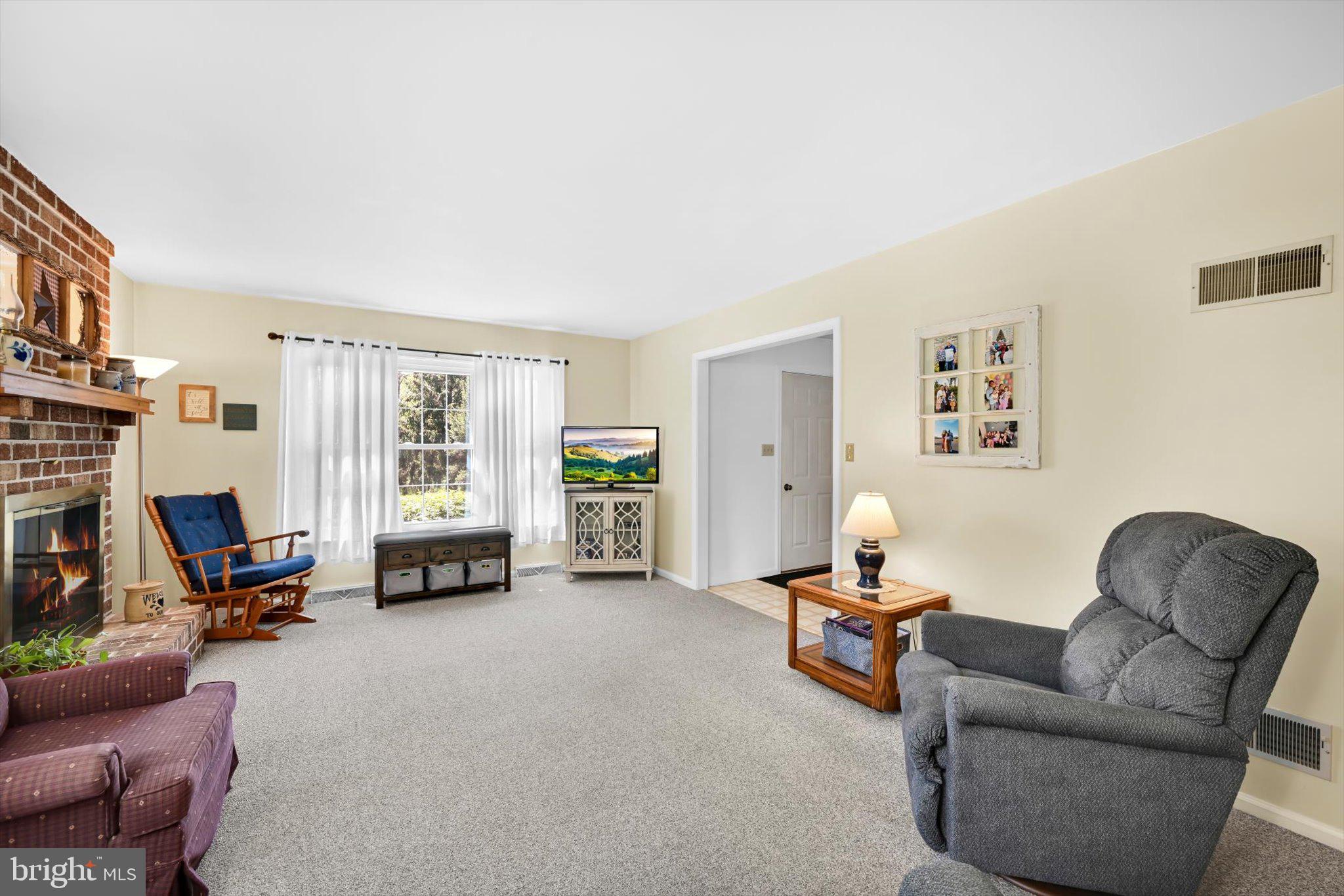 30 Edgewood Drive Lititz, PA 17543 - Photo 8 of 47 a living room with furniture and a flat screen tv