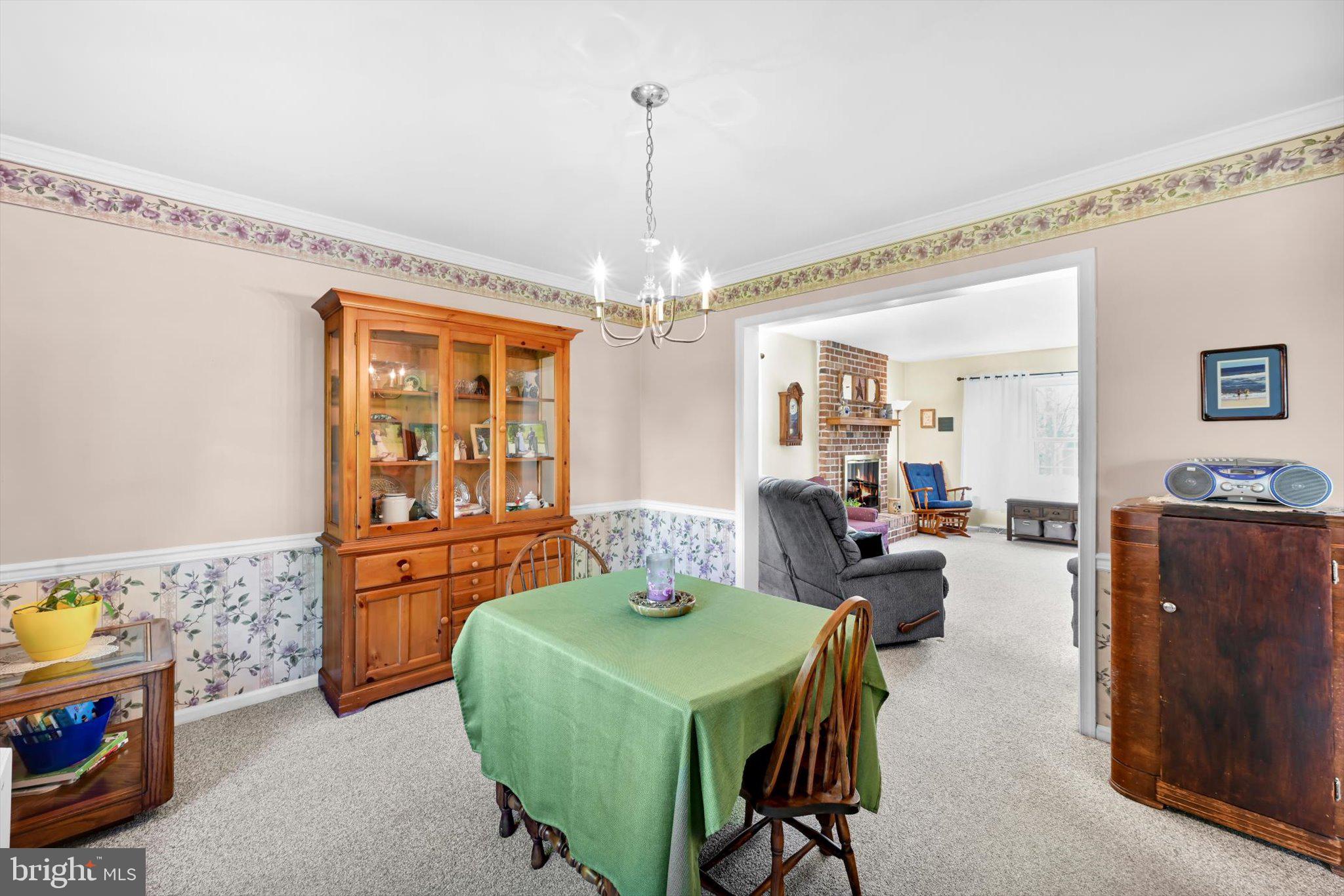 30 Edgewood Drive Lititz, PA 17543 - Photo 9 of 47 a living room with furniture and a chandelier