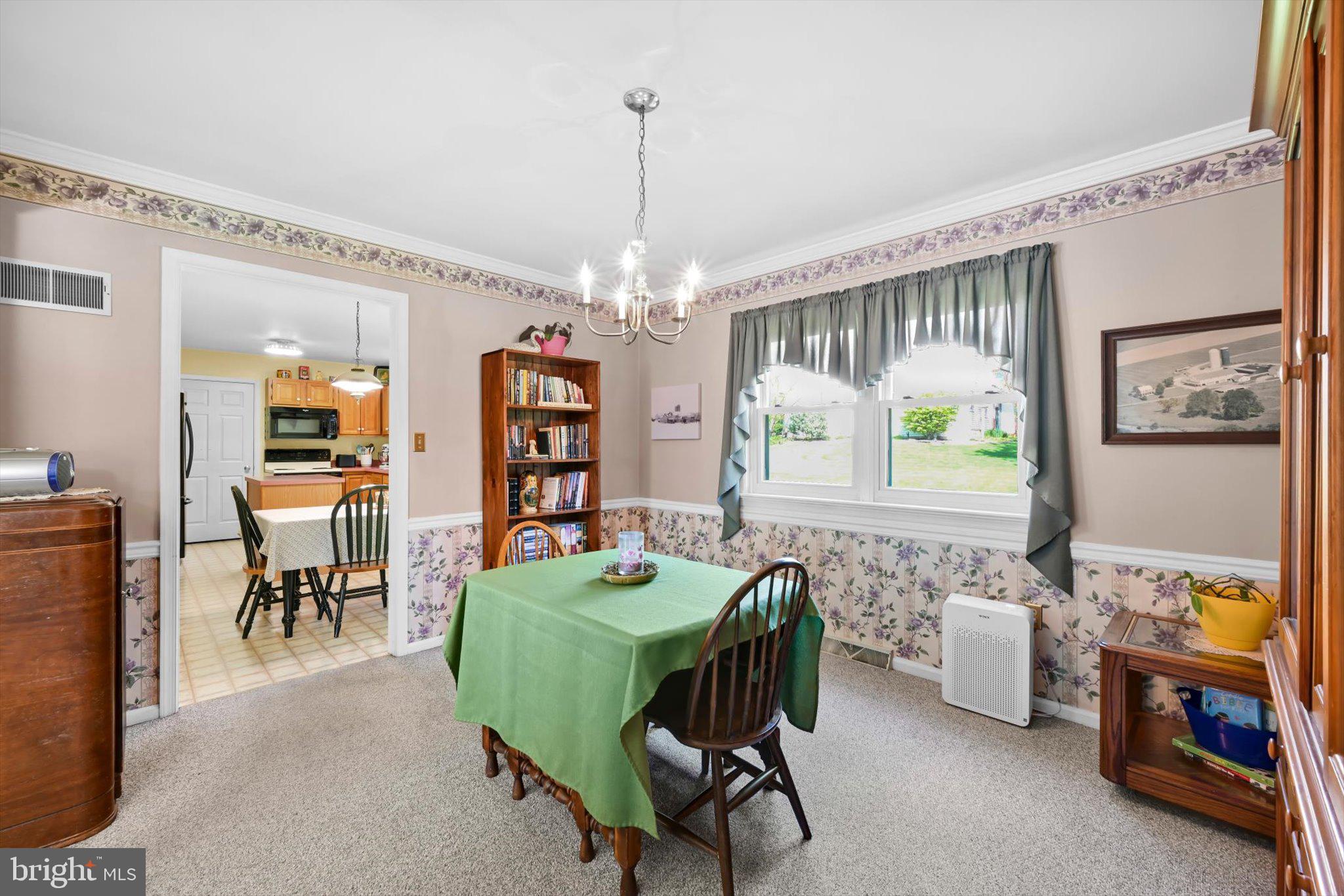 30 Edgewood Drive Lititz, PA 17543 - Photo 10 of 47 a living room with furniture and a chandelier