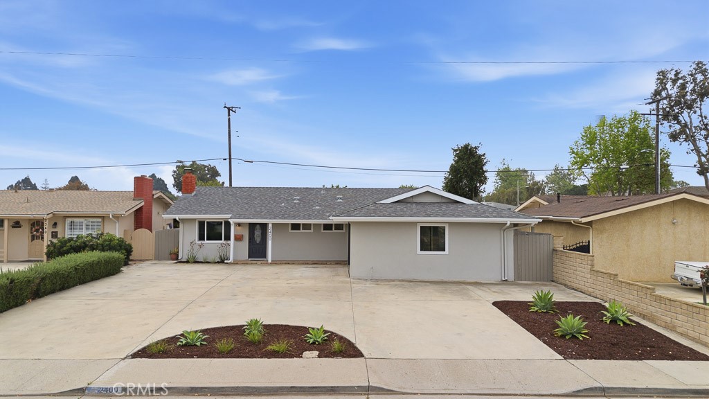 2400 West Hemlock Street Oxnard, CA 93035 - Photo 1 of 1 a front view of a house with a garden