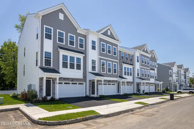 a view of a building with a yard