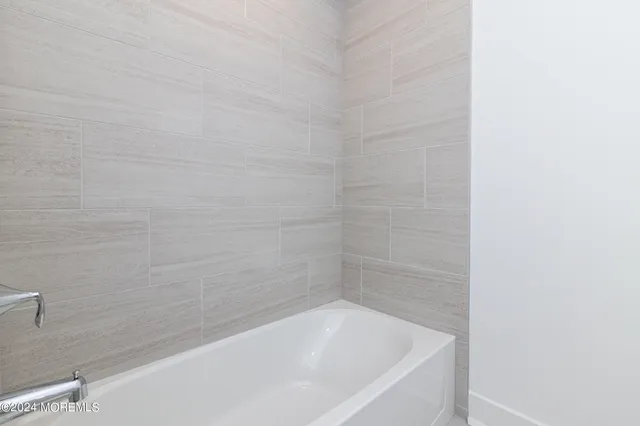 a close up of a bathtub in a bathroom