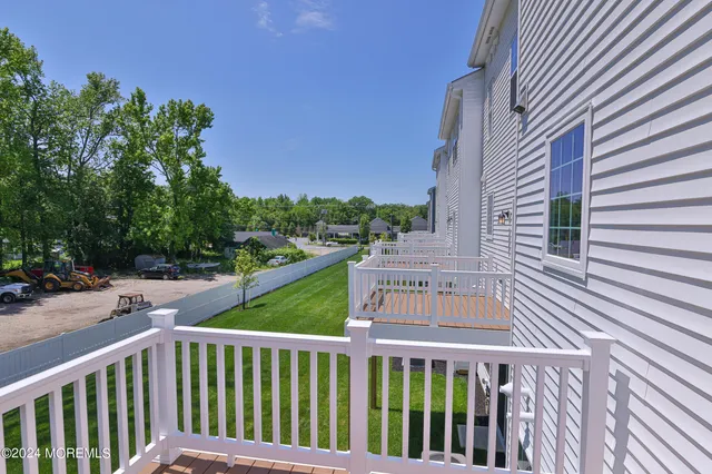 a view of a houses with a street