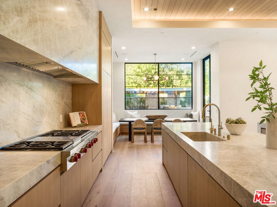 17321 Rancho Street Encino, CA 91316 - Photo 16 of 52 a kitchen with sink stove and refrigerator