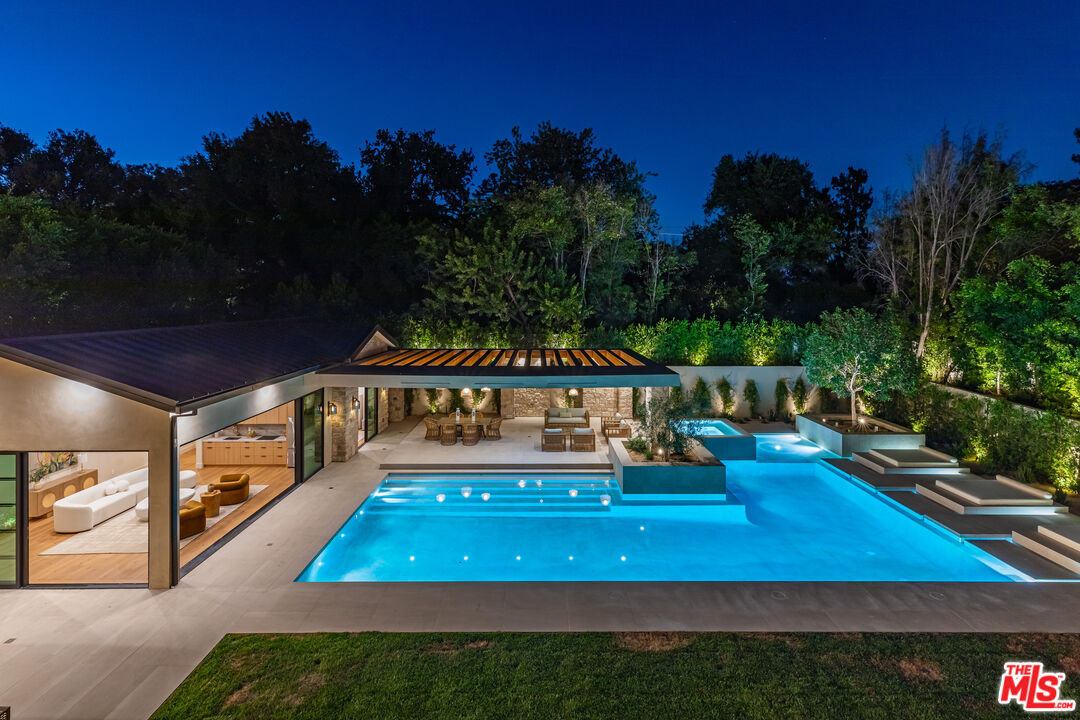 17321 Rancho Street Encino, CA 91316 - Photo 19 of 52 a view of a wooden deck with sunset view
