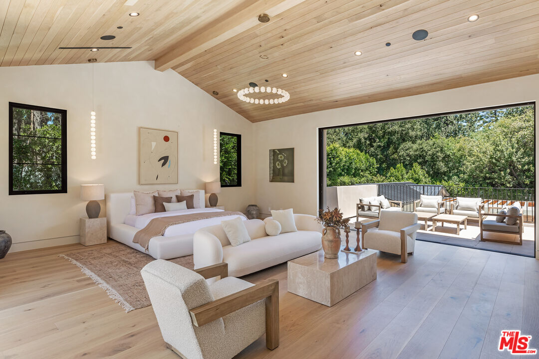 17321 Rancho Street Encino, CA 91316 - Photo 25 of 52 a living room with furniture and a large window