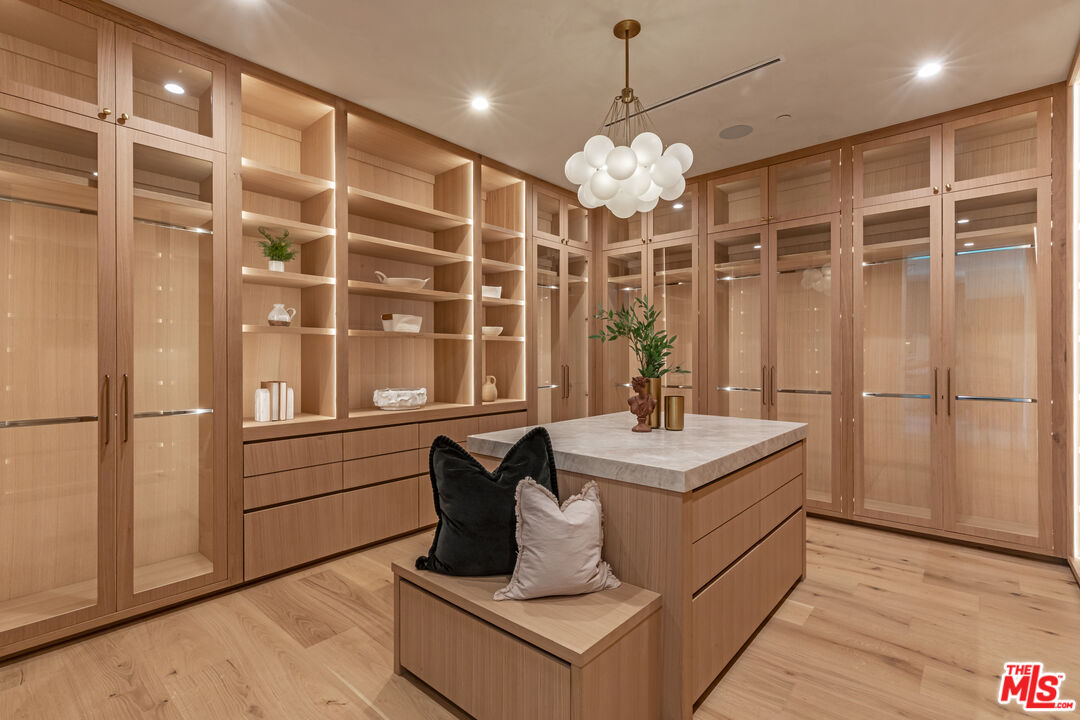 17321 Rancho Street Encino, CA 91316 - Photo 29 of 52 a very nice looking room with a large window and chandelier