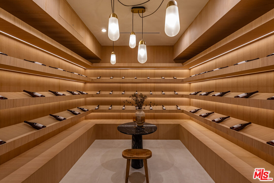 17321 Rancho Street Encino, CA 91316 - Photo 37 of 52 a room with lots of frames on wall and window