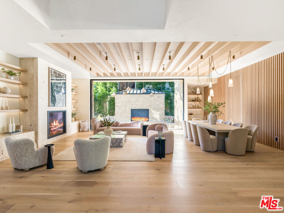 17321 Rancho Street Encino, CA 91316 - Photo 4 of 52 a living room with furniture and a large window