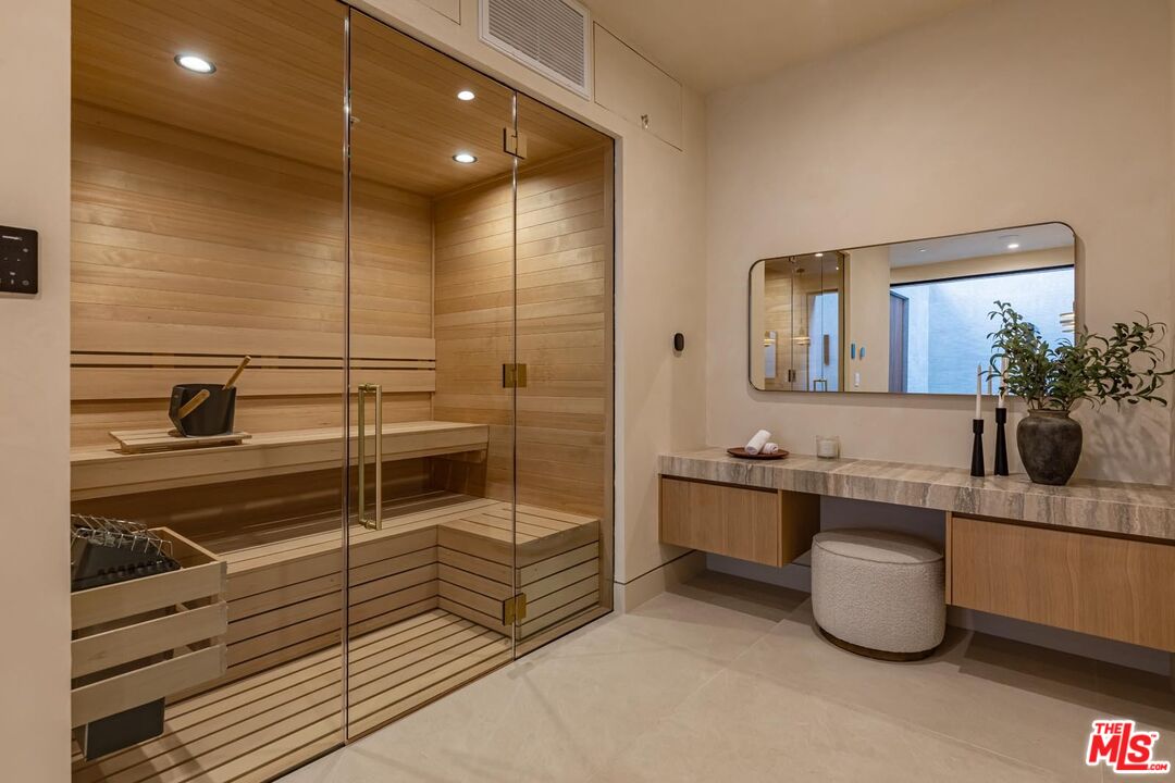 17321 Rancho Street Encino, CA 91316 - Photo 43 of 52 a bathroom with a tub sink and mirror