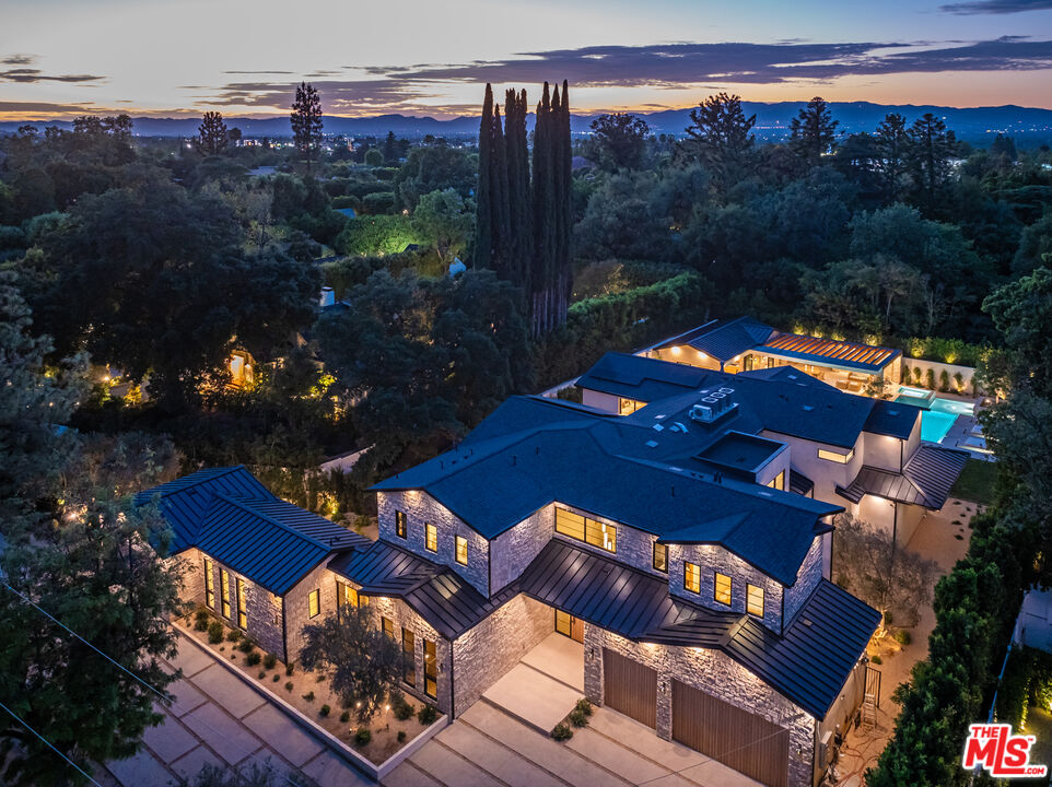 17321 Rancho Street Encino, CA 91316 - Photo 52 of 52 a view of a chairs and table in the patio