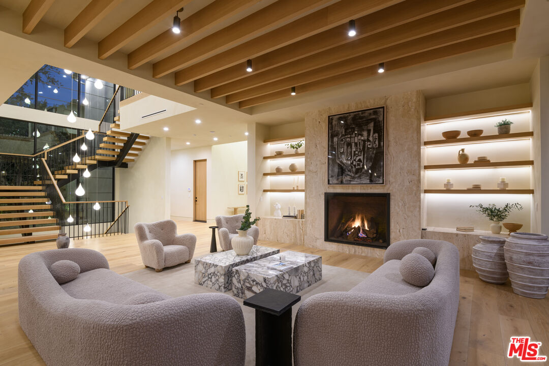 17321 Rancho Street Encino, CA 91316 - Photo 6 of 52 a living room with furniture and a fireplace