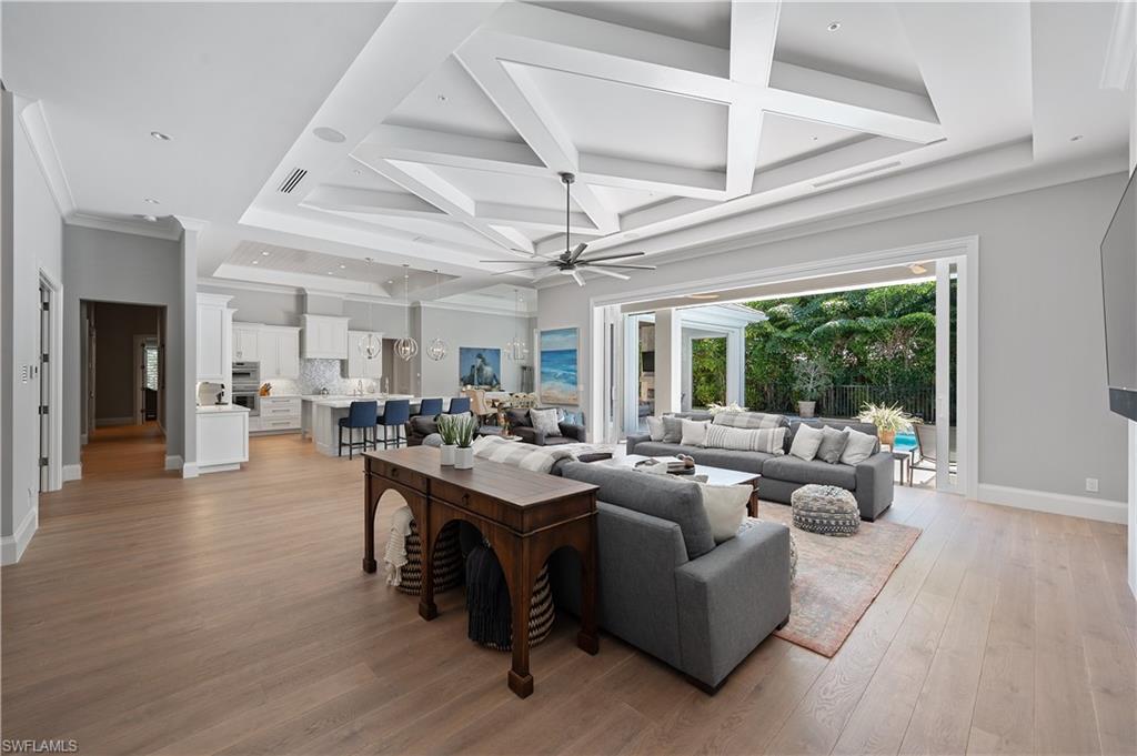 680 Yucca Road Naples, FL 34102 - Photo 2 of 31 a living room with furniture and a large window