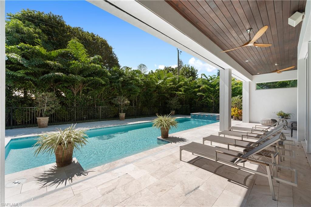 680 Yucca Road Naples, FL 34102 - Photo 5 of 31 a view of backyard with seating area and green space