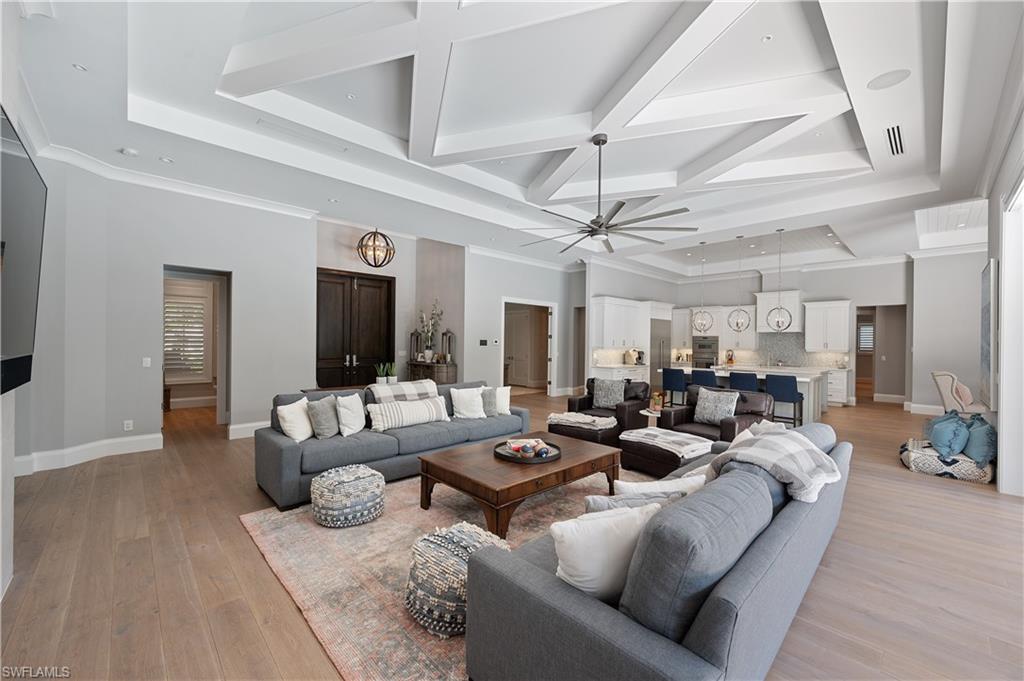 680 Yucca Road Naples, FL 34102 - Photo 7 of 31 a living room with furniture and a large window