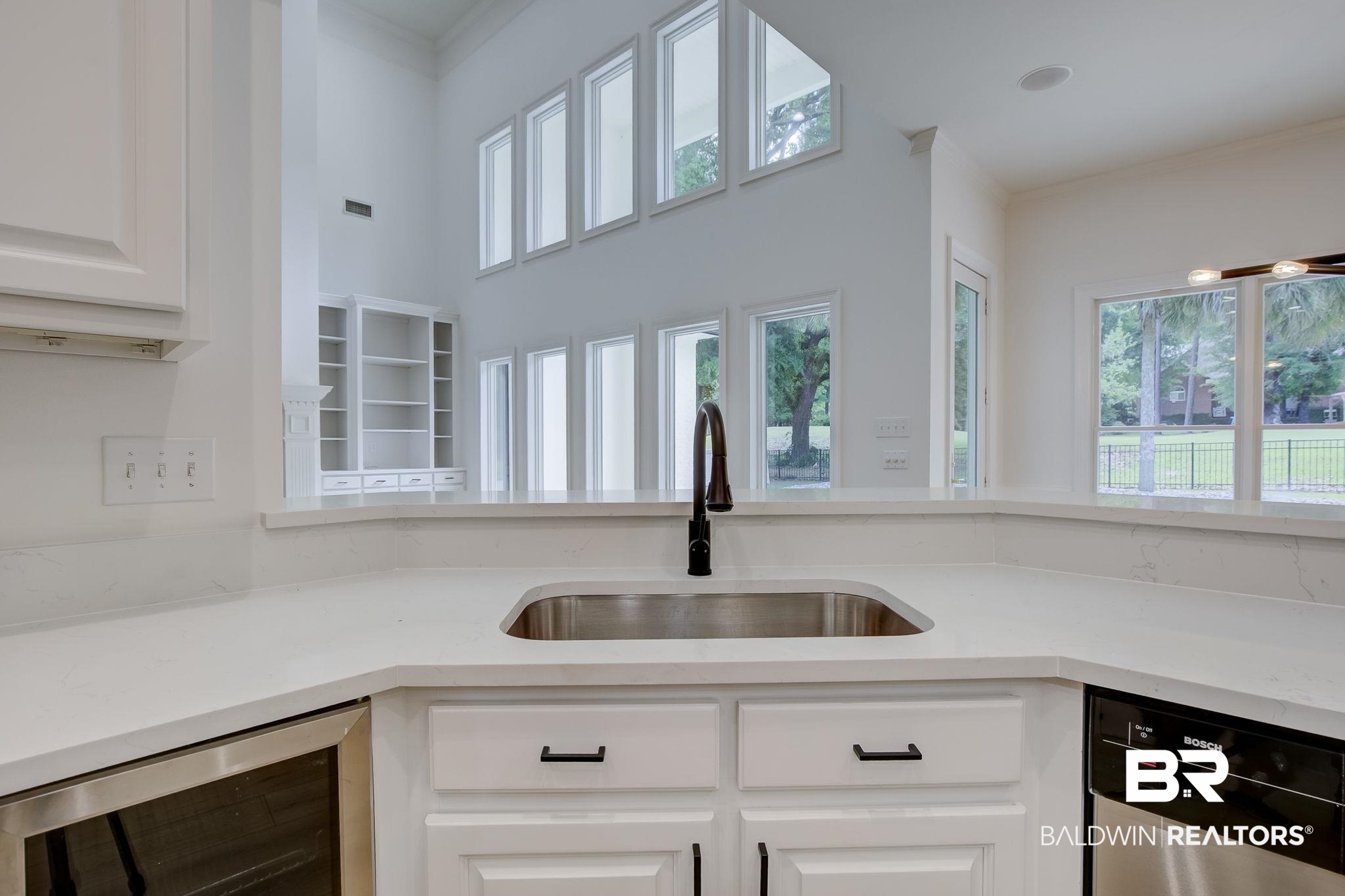 105 High Pines Ridge Fairhope, AL 36532 - Photo 30 of 97 Kitchen featuring wine cooler, stainless steel dishwasher, a sink, and plenty of natural light