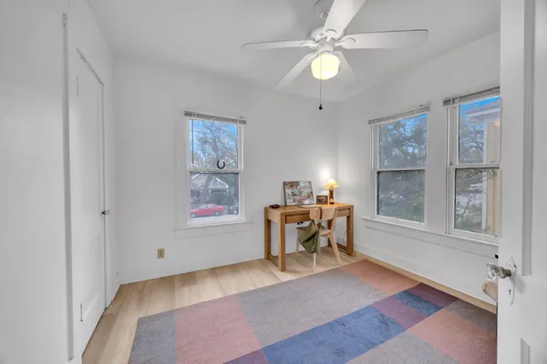 a view of a livingroom with furniture and a window