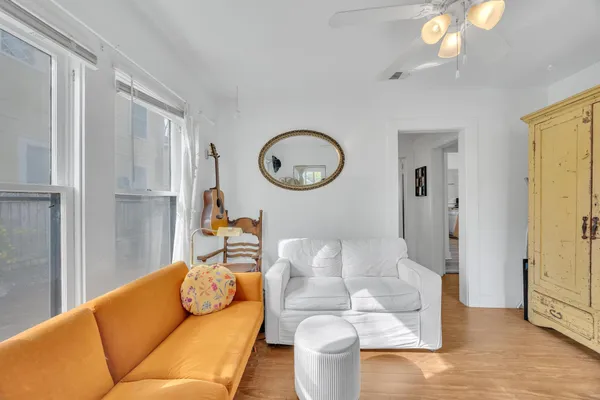 a living room with furniture and a window