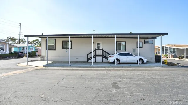 a view of a car park in front of house