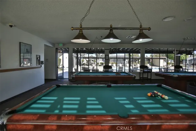 a room with lots of potted plants and wooden floor