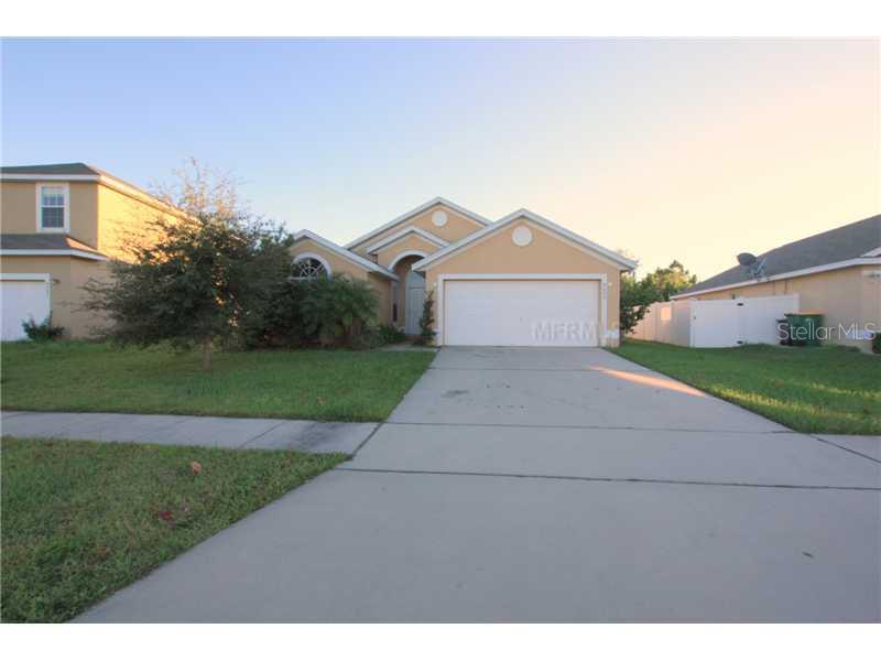 4095 Longworth Loop Kissimmee, FL 34744 - Photo 1 of 1 a front view of a house with a yard