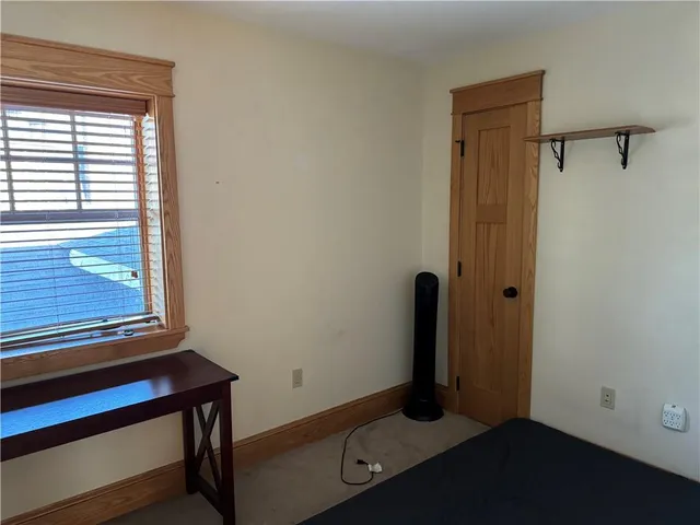a view of a dining room with furniture and a chandelier