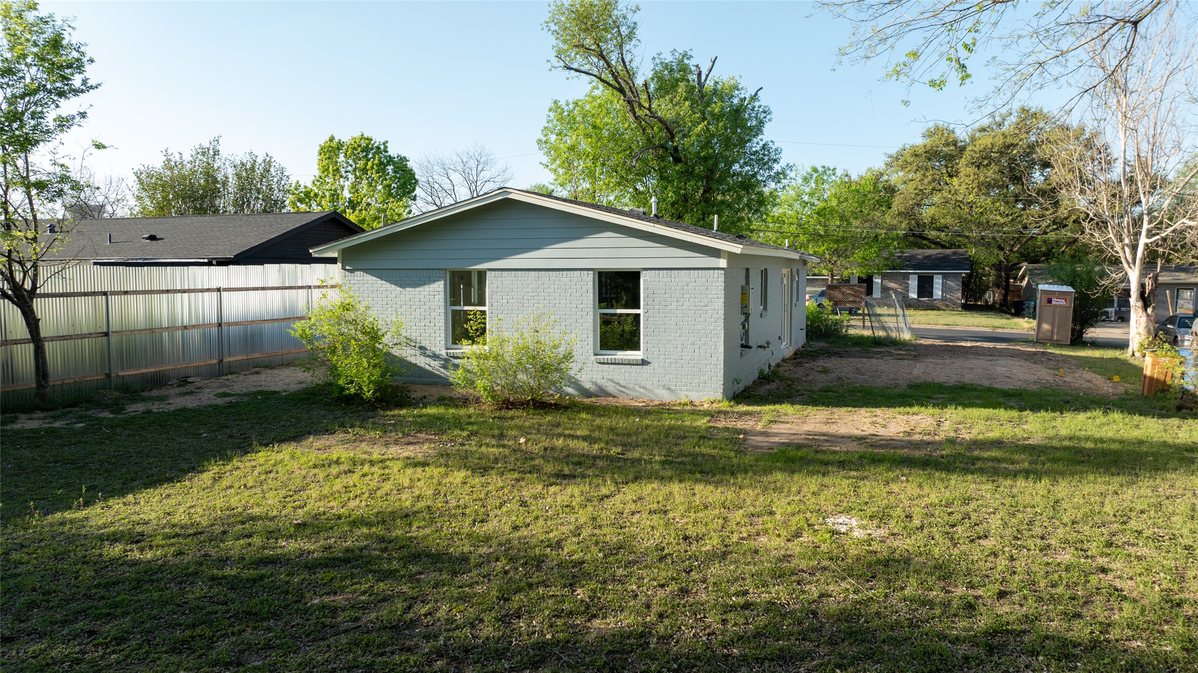 4902 Blueberry Trail, Unit 2 & 3 Austin, TX 78723 - Photo 15 of 38 a view of a house with a yard