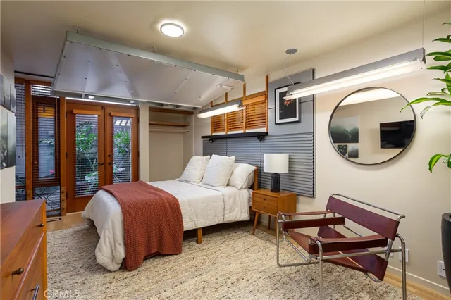 a bedroom with a bed and window