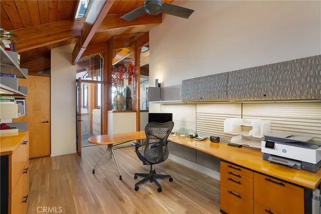 a view of a kitchen with workspace and wooden floor