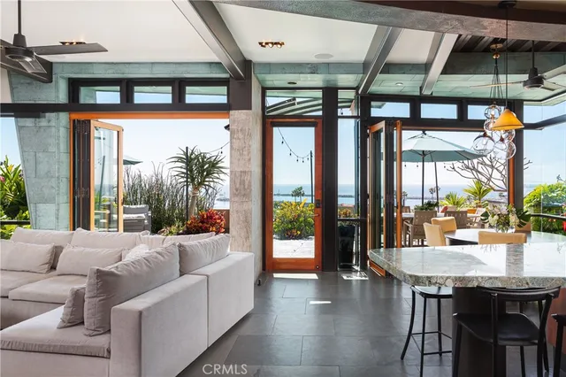 a view of a patio with a table and chairs under an umbrella
