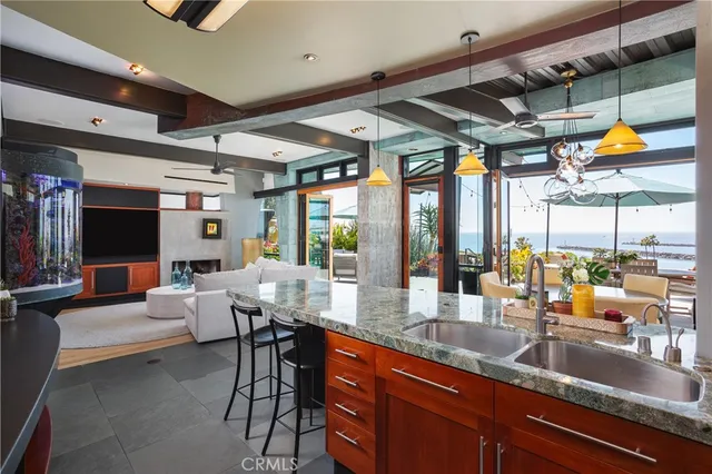 a kitchen with granite countertop a sink and a counter top space